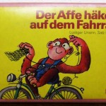 Kartenspiele Der Affe haekelt auf dem Fahrrad